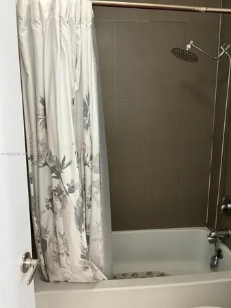 a en suite bathroom with a sink toilet and mirror