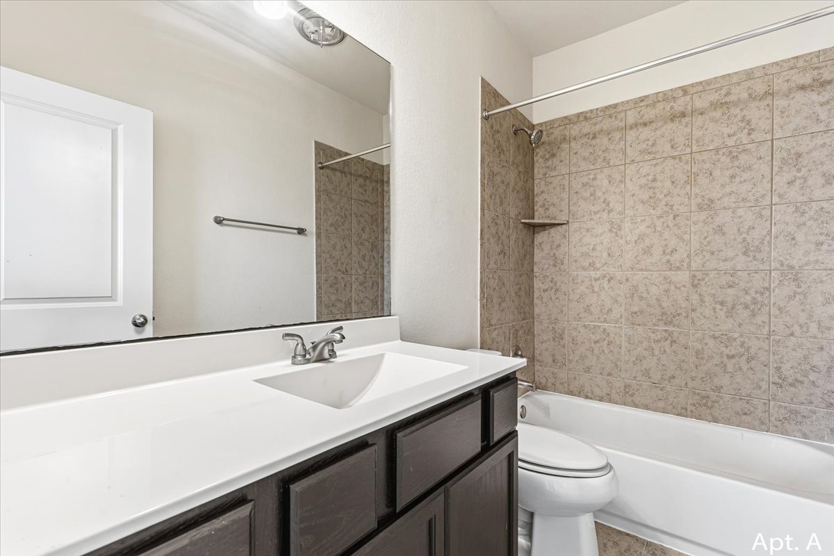 2225 Katy Lane, Unit A Georgetown, TX 78626 - Photo 17 of 22 Full bath with vanity and washtub / shower combination
