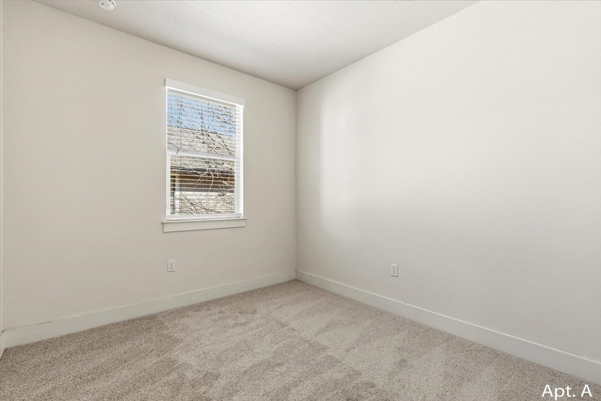 2225 Katy Lane, Unit A Georgetown, TX 78626 - Photo 18 of 22 Carpeted empty room with baseboards
