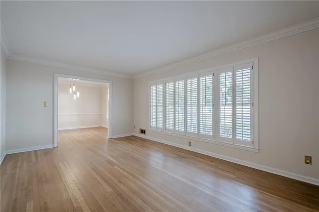 a view of a kitchen with wooden floor and a sink