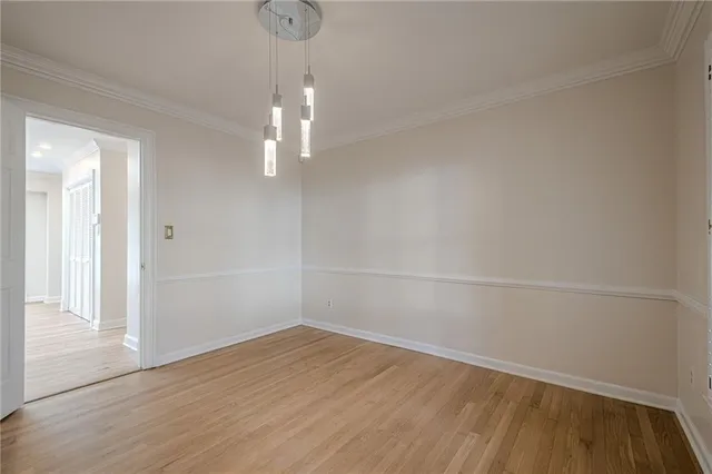 a open kitchen with stainless steel appliances granite countertop a stove a sink dishwasher a refrigerator and a oven with wooden floor