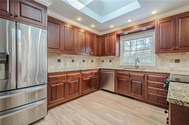 wooden floor in an empty room with a fireplace