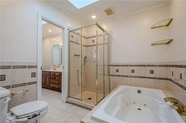 a view of an empty room with wooden floor fireplace and a window