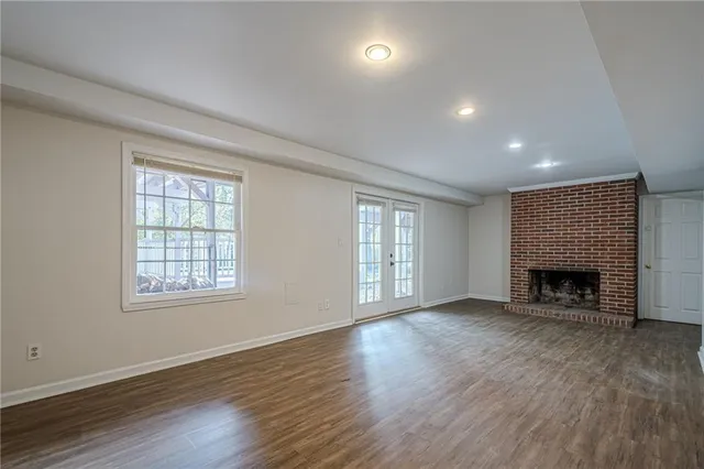 a view of backyard with a deck and wooden floor