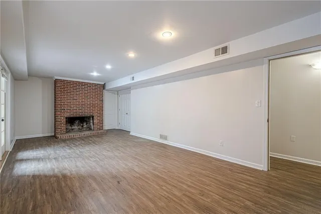 a view of a wooden floor with a bench