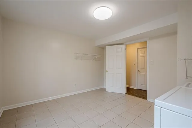 a view of backyard with deck and garden