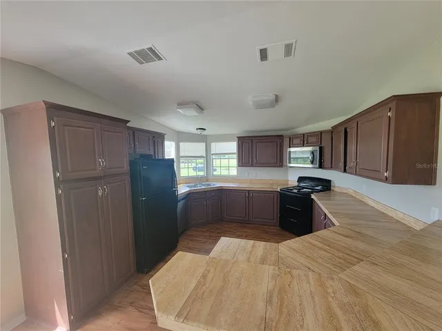 a room with a bed and a large window