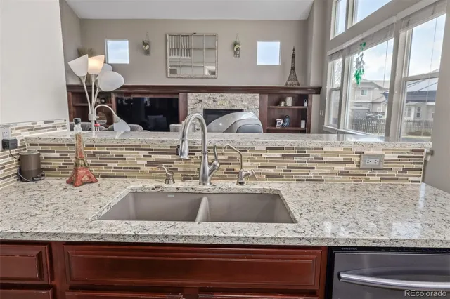 a kitchen counter with kitchen island a counter top space and a sink