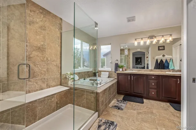 a bathroom with a bathtub and a sink