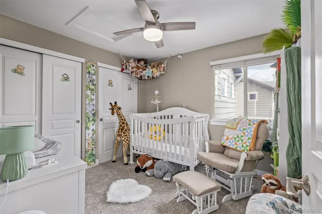 a bathroom with a granite countertop sink toilet a mirror a vanity and shower