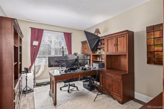 a room with furniture a rug and a window