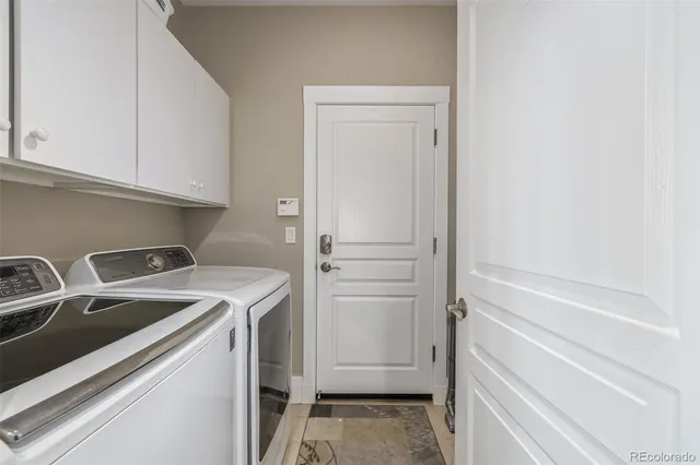 a kitchen with stainless steel appliances a refrigerator and a window