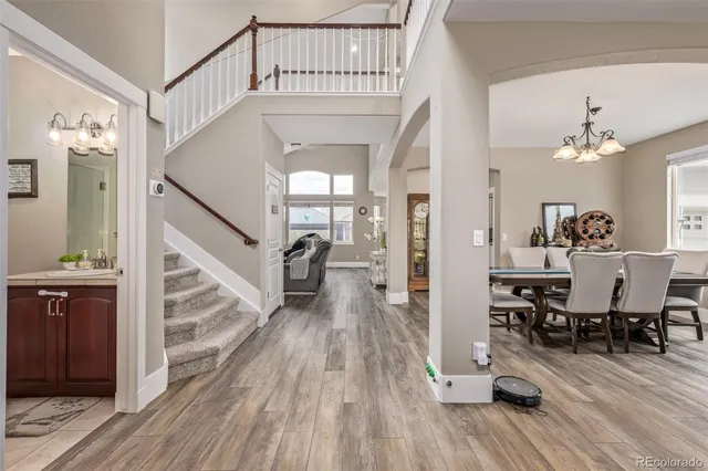 a view of a livingroom with furniture and hardwood floor