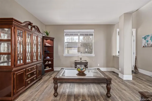 a view of a dining room with furniture window and wooden floor