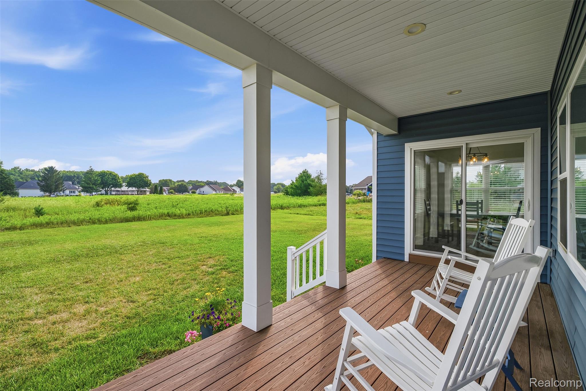 9087 Copper Ridge Drive Davison, MI 48423 - Photo 42 of 46 Covered exterior porch with wood-finish decking and white support columns