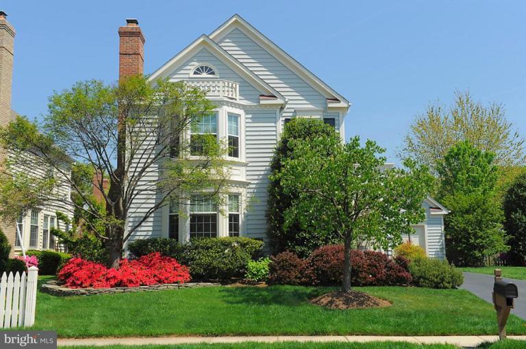 6583 Forsythia Street Springfield, VA 22150 - Photo 1 of 28 a front view of a house with a yard