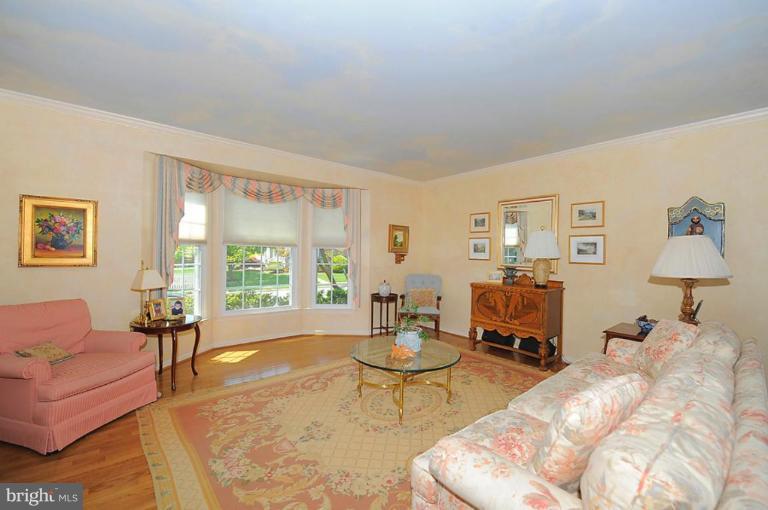 6583 Forsythia Street Springfield, VA 22150 - Photo 2 of 28 a living room with furniture and a large window