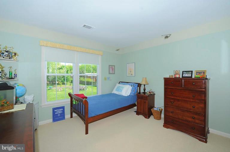 6583 Forsythia Street Springfield, VA 22150 - Photo 17 of 28 a living room with furniture and a window