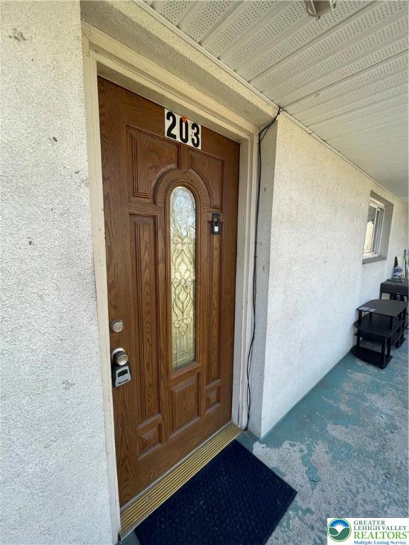 4429 Steuben Road, Unit 203 Bethlehem, PA 18020 - Photo 2 of 8 a view of front door with wooden floor