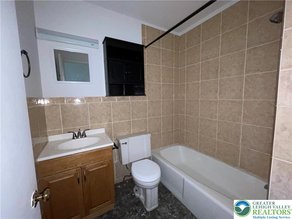 4429 Steuben Road, Unit 203 Bethlehem, PA 18020 - Photo 8 of 8 a bathroom with a sink a toilet and shower
