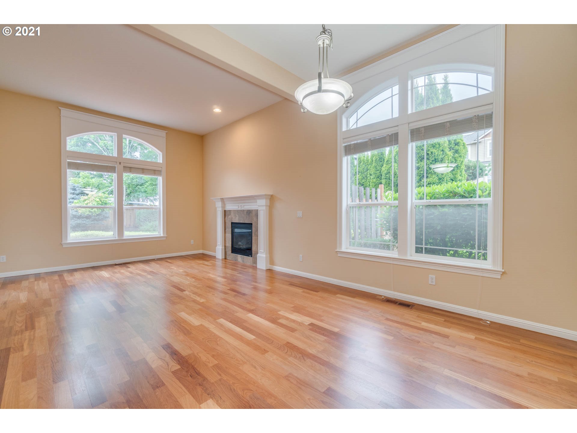 3113 Northwest 30th Circle Camas, WA 98607 - Photo 19 of 32 a view of an empty room with wooden floor and a window