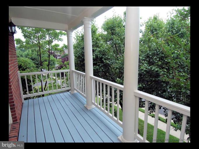 6601 Forsythia Street Springfield, VA 22150 - Photo 13 of 26 a view of a wooden deck with chairs