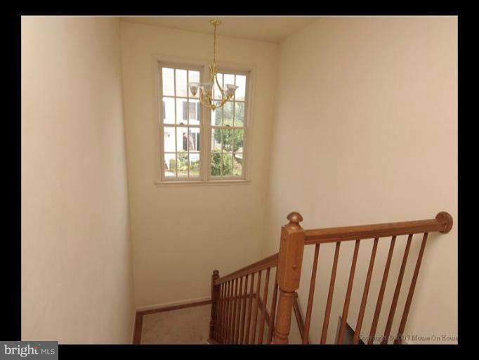6601 Forsythia Street Springfield, VA 22150 - Photo 16 of 26 a view of a porch with wooden floor