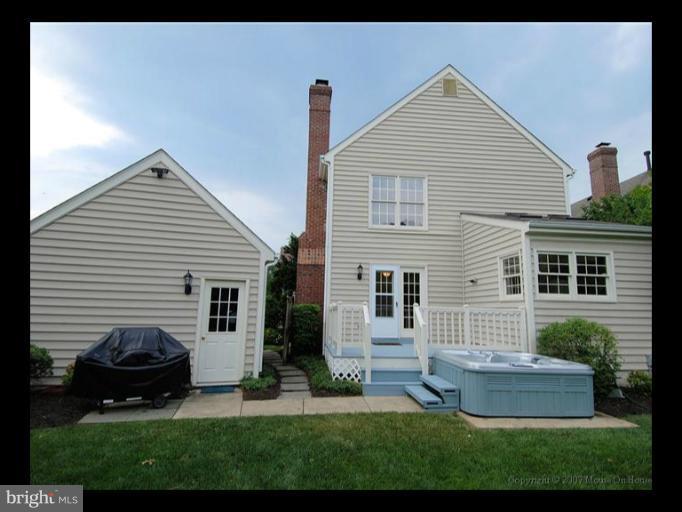 6601 Forsythia Street Springfield, VA 22150 - Photo 17 of 26 a view of a house with a yard and a garden