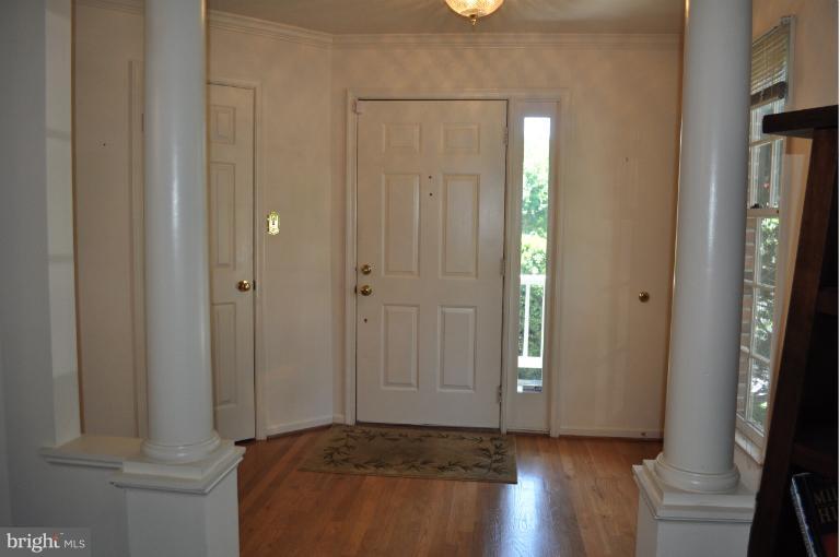 6601 Forsythia Street Springfield, VA 22150 - Photo 7 of 26 a view of an empty room with closet and wooden floor