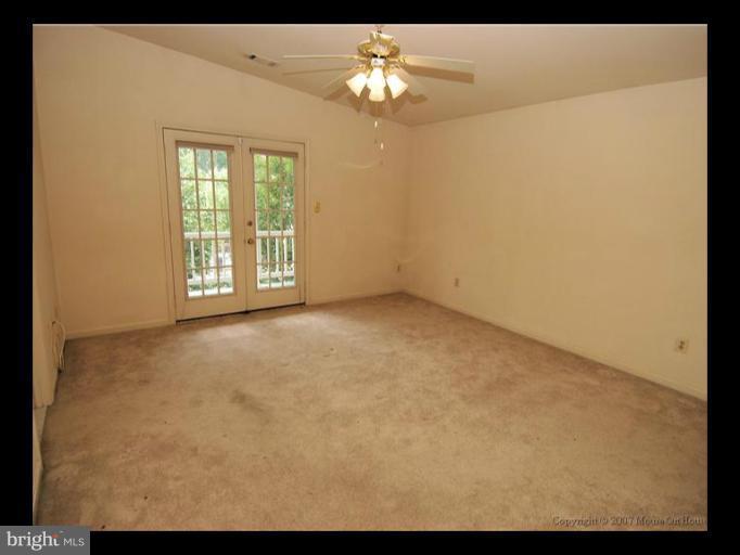 6601 Forsythia Street Springfield, VA 22150 - Photo 9 of 26 a view of an empty room with a window