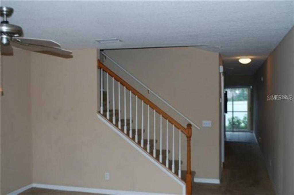 3419 Dragon View Court Valrico, FL 33594 - Photo 2 of 17 a view of staircase with railing and white walls