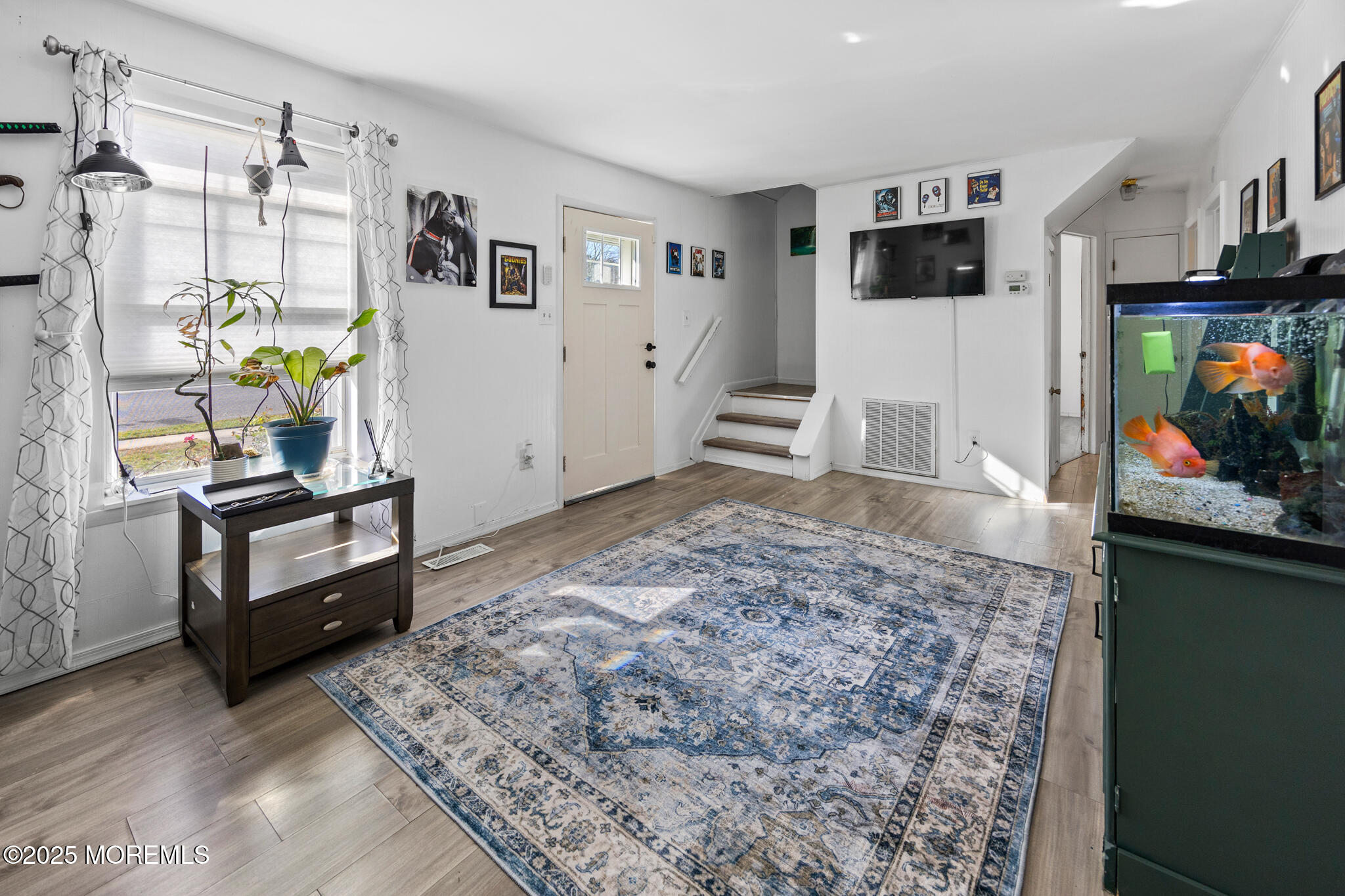 14 Georgetown Boulevard Barnegat, NJ 08005 - Photo 16 of 39 a living room with furniture and a flat screen tv