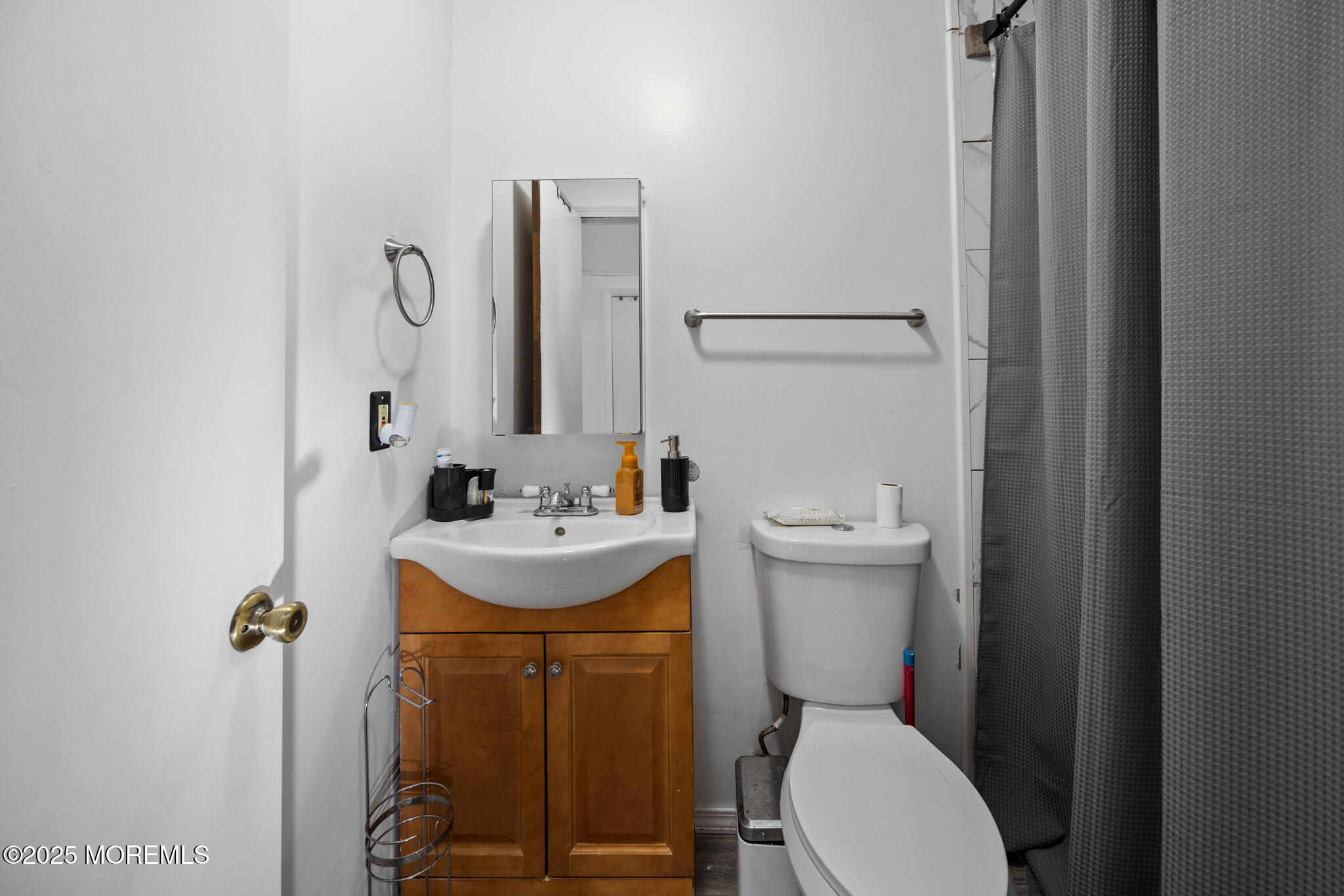 14 Georgetown Boulevard Barnegat, NJ 08005 - Photo 18 of 39 a bathroom with a toilet sink and mirror