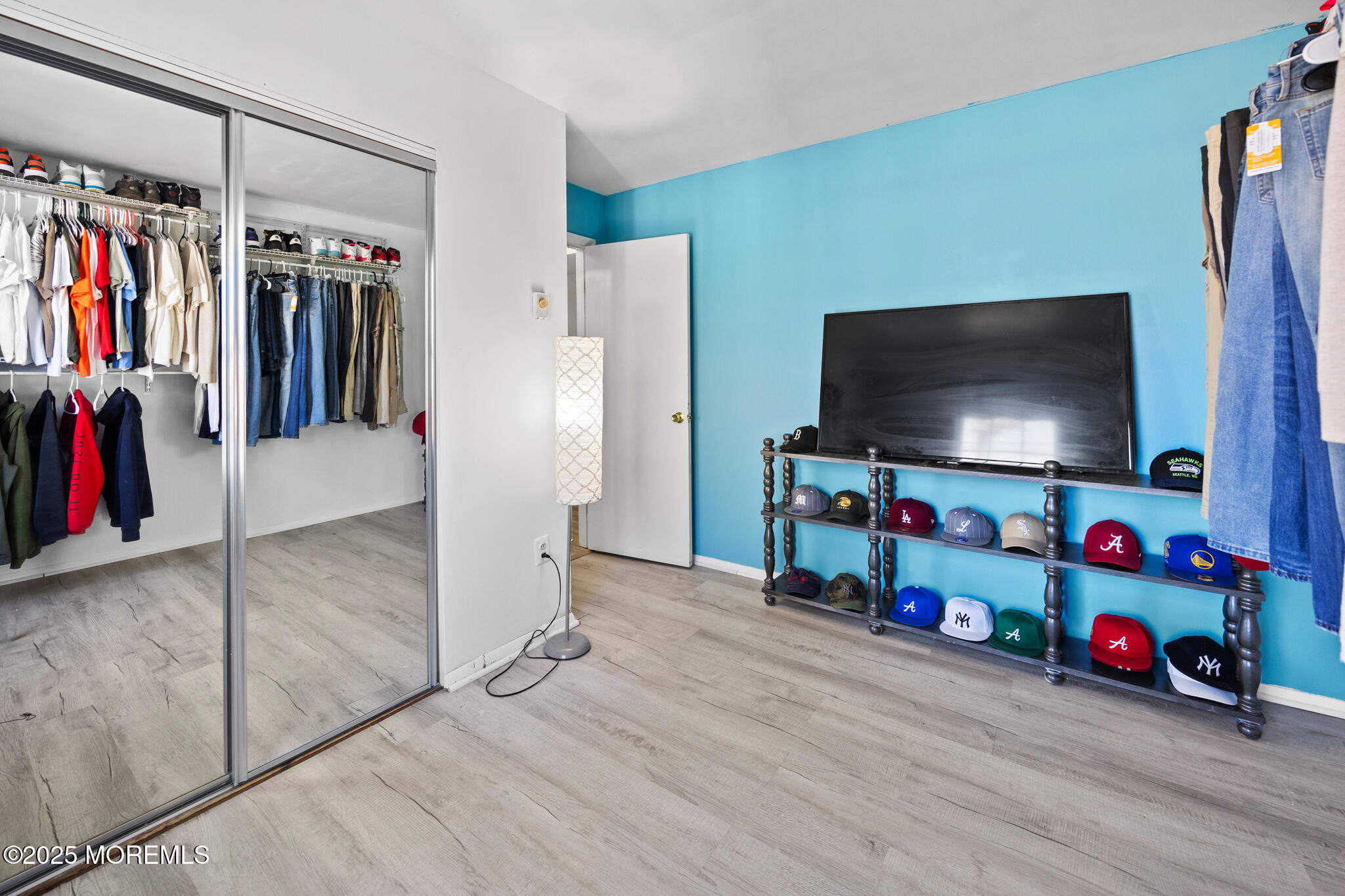 14 Georgetown Boulevard Barnegat, NJ 08005 - Photo 23 of 39 a room with lots of white furniture and a flat screen tv