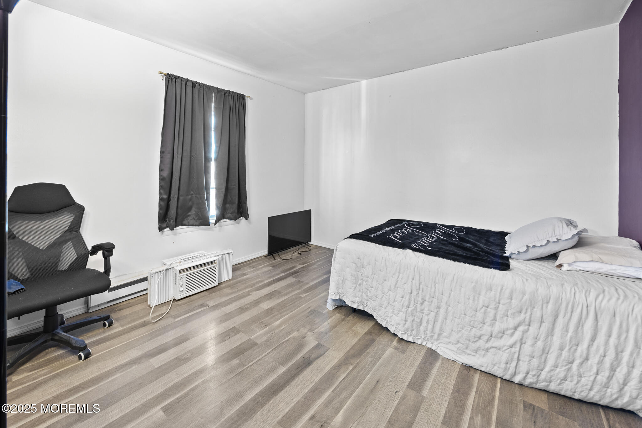 14 Georgetown Boulevard Barnegat, NJ 08005 - Photo 26 of 39 a bedroom with a bed and wooden floor