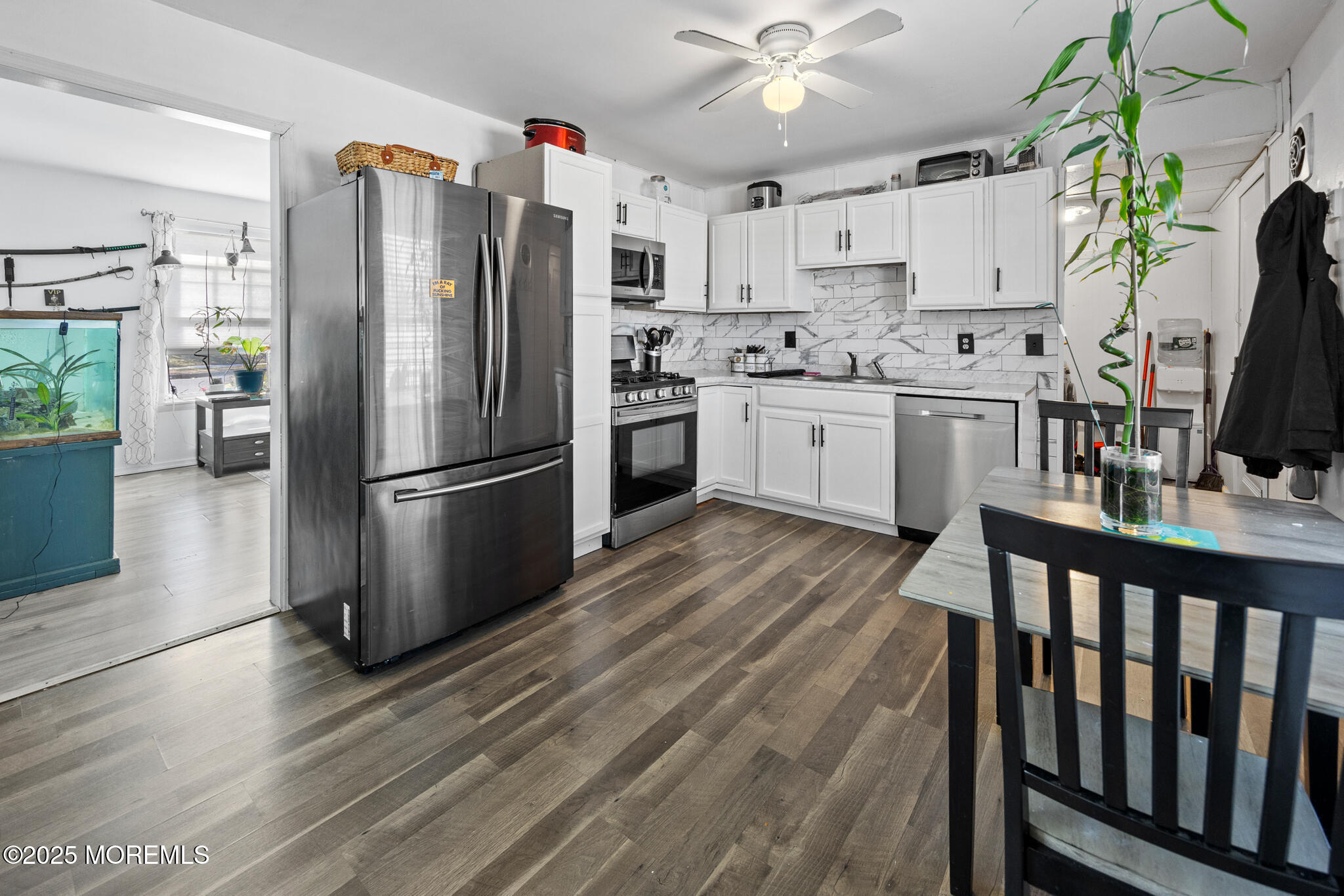 14 Georgetown Boulevard Barnegat, NJ 08005 - Photo 3 of 39 a kitchen with stainless steel appliances a refrigerator sink and white cabinets