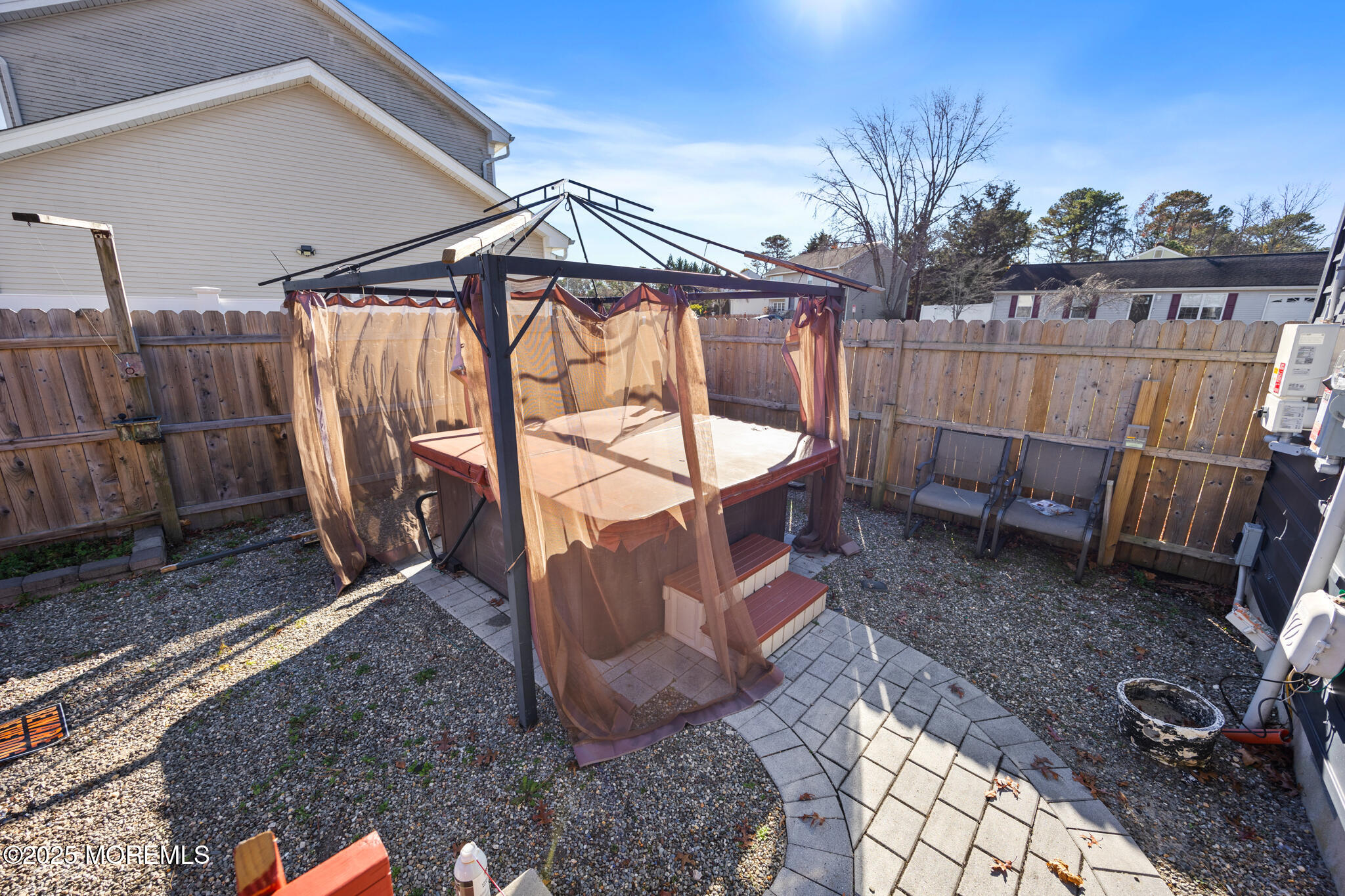 14 Georgetown Boulevard Barnegat, NJ 08005 - Photo 32 of 39 a view of a backyard with a tub and wooden fence