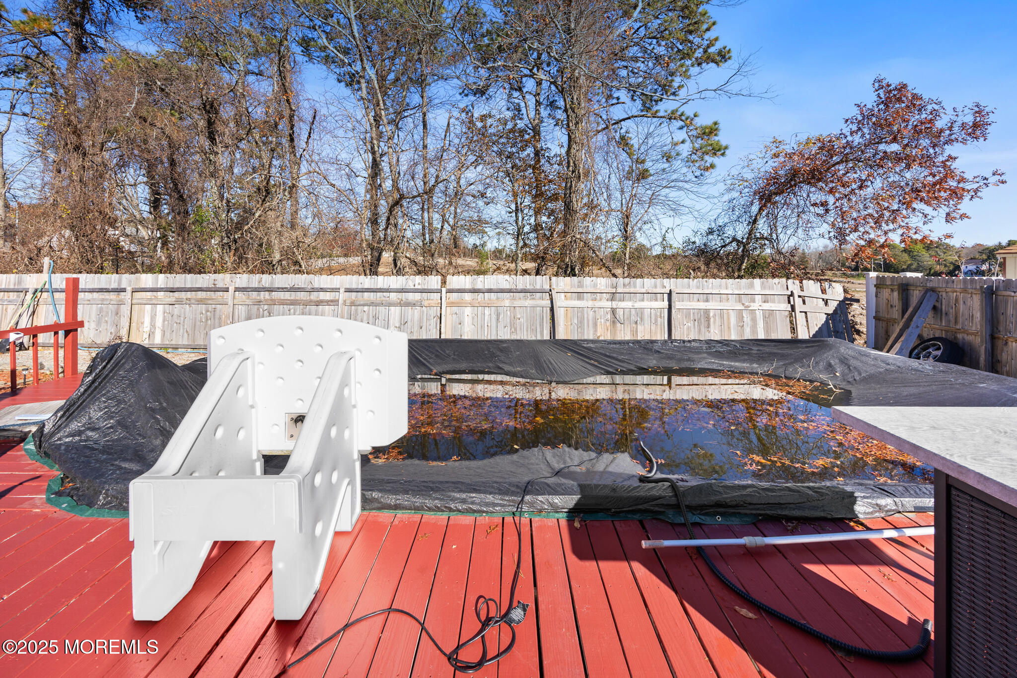 14 Georgetown Boulevard Barnegat, NJ 08005 - Photo 33 of 39 a view of roof deck with wooden floor and fence with a barbeque
