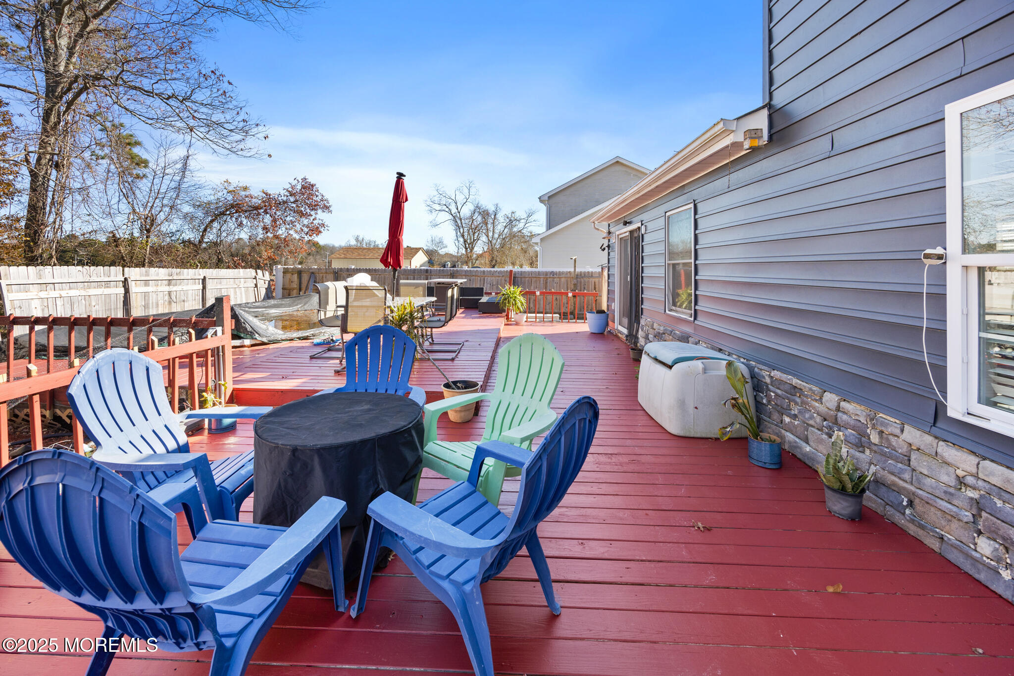 14 Georgetown Boulevard Barnegat, NJ 08005 - Photo 5 of 39 a view of a chairs and table on the roof deck