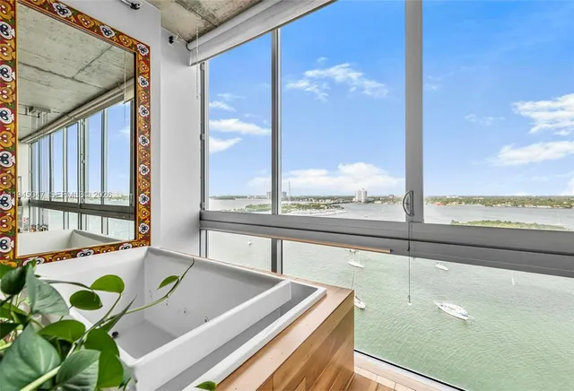 a view of a balcony dining table chairs and wooden floor
