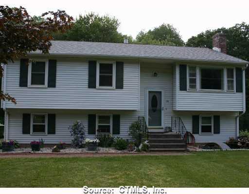 126 Shunpike Road Cromwell, CT 06416 - Photo 1 of 1 a front view of a house with a yard