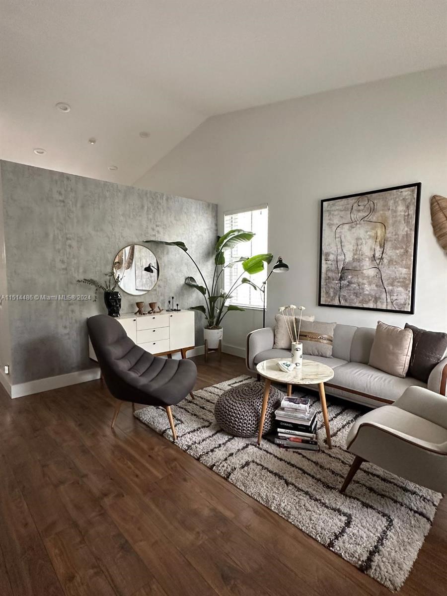 941 Falling Water Road, Unit 941 Weston, FL 33326 - Photo 2 of 4 a living room with furniture a rug and a table