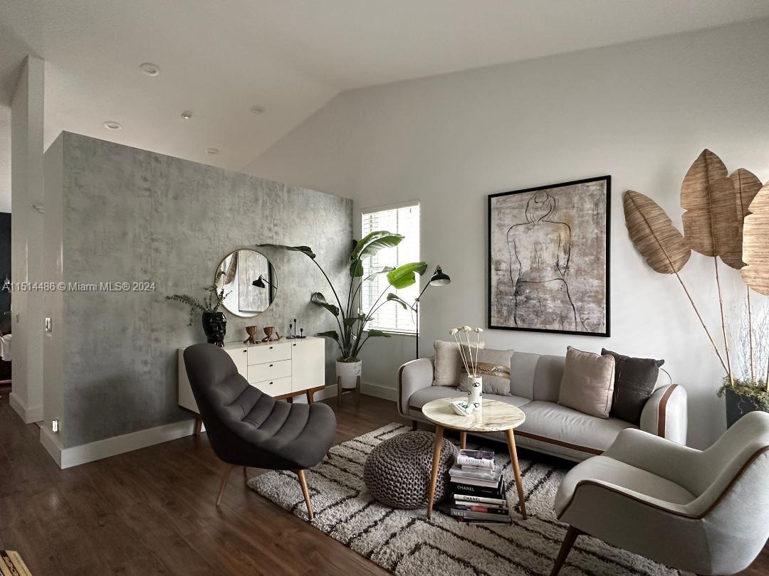941 Falling Water Road, Unit 941 Weston, FL 33326 - Photo 3 of 4 a living room with furniture and wooden floor