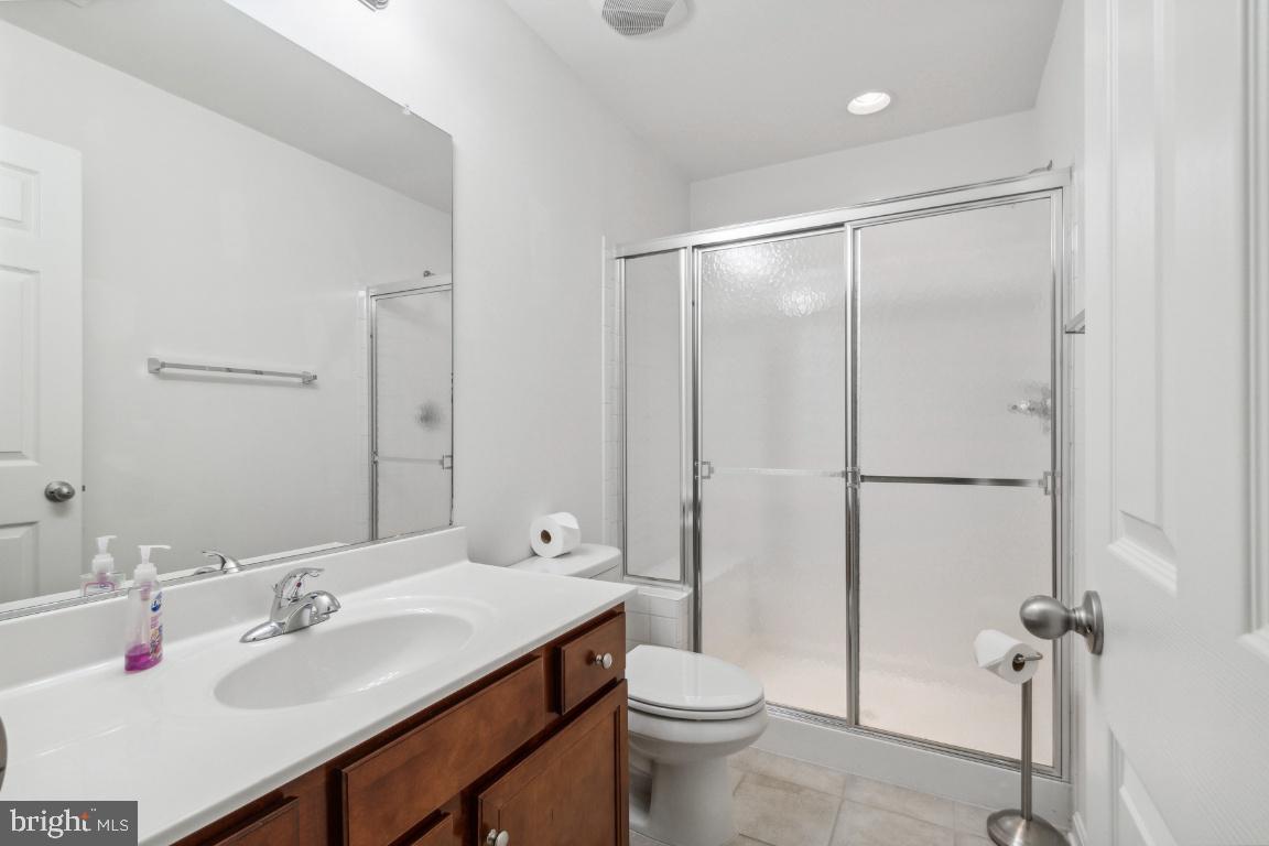 42219 Dean Chapel Square Chantilly, VA 20152 - Photo 18 of 21 a bathroom with a sink toilet and shower