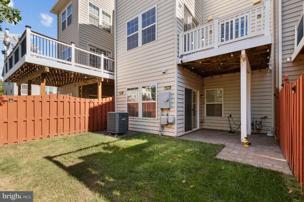 42219 Dean Chapel Square Chantilly, VA 20152 - Photo 20 of 21 a view of a house with a yard and sitting area