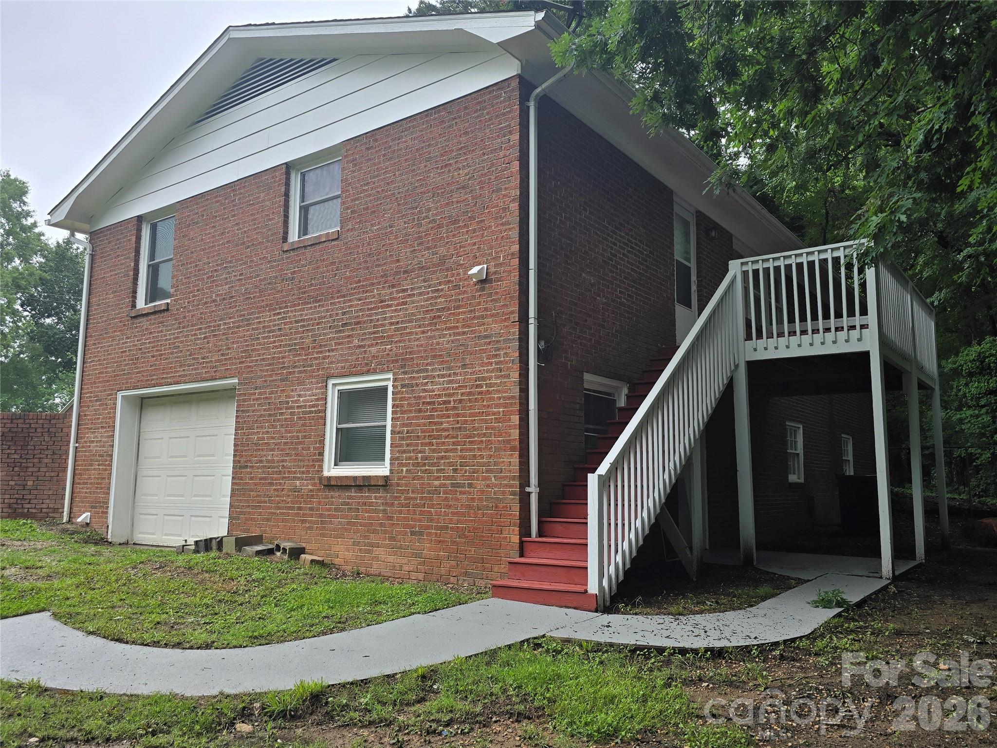 1660 Songwood Road Concord, NC 28025 - Photo 3 of 26 a front view of a house with a yard