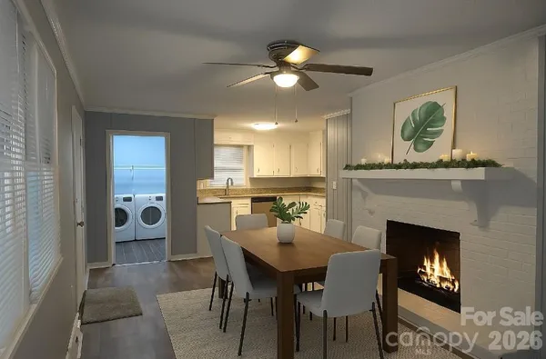 a dining room with furniture and a fireplace