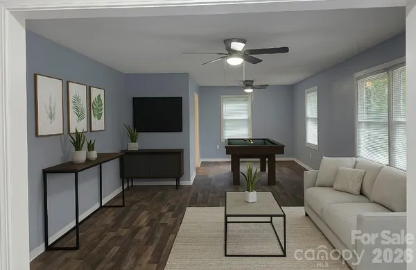 a living room with furniture and a flat screen tv