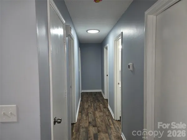 a view of hallway with parking area