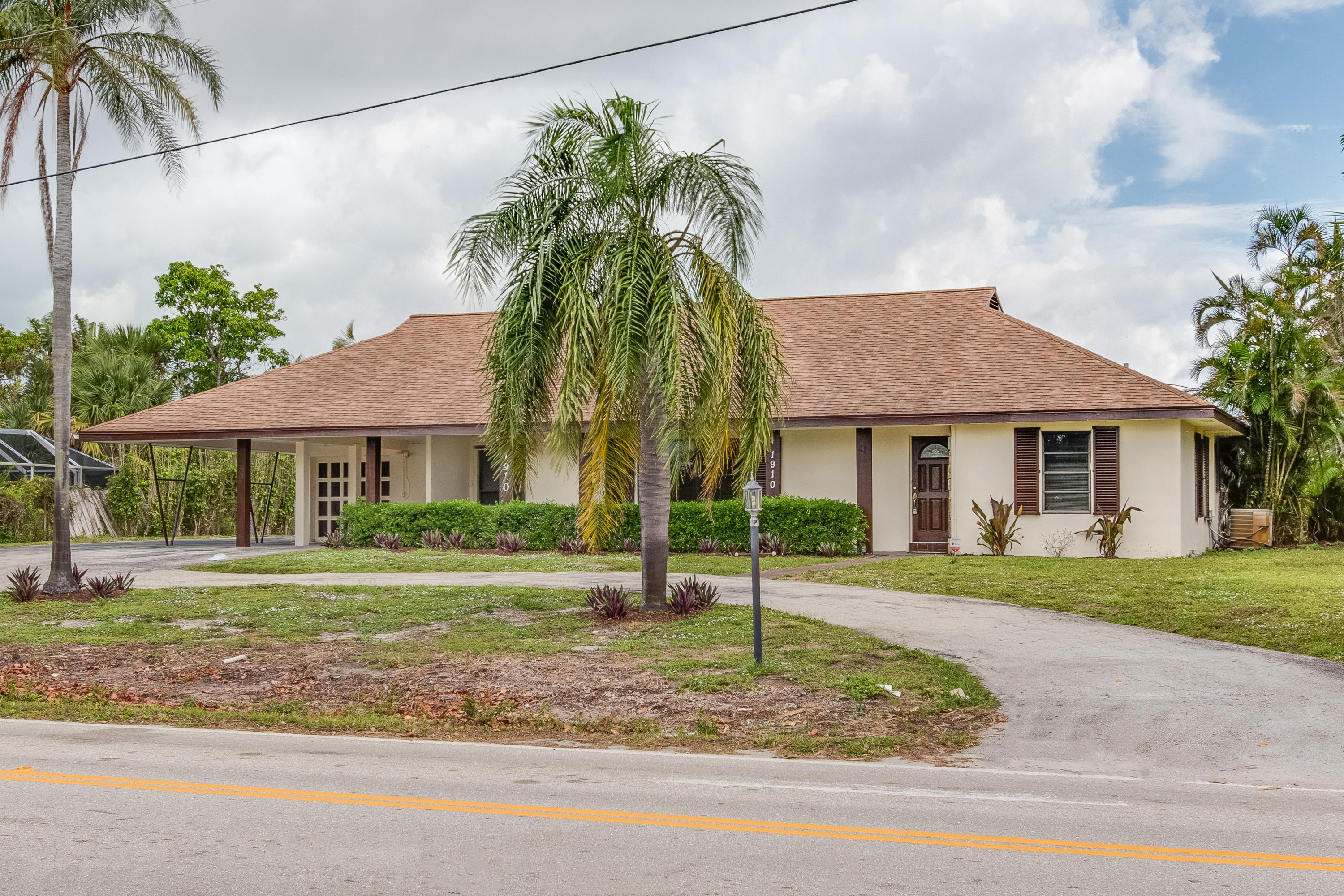 1910 High Ridge Road Lake Worth, FL 33461 - Photo 1 of 27 003-1910HighRidgeRd-LakeWorth-FL-full